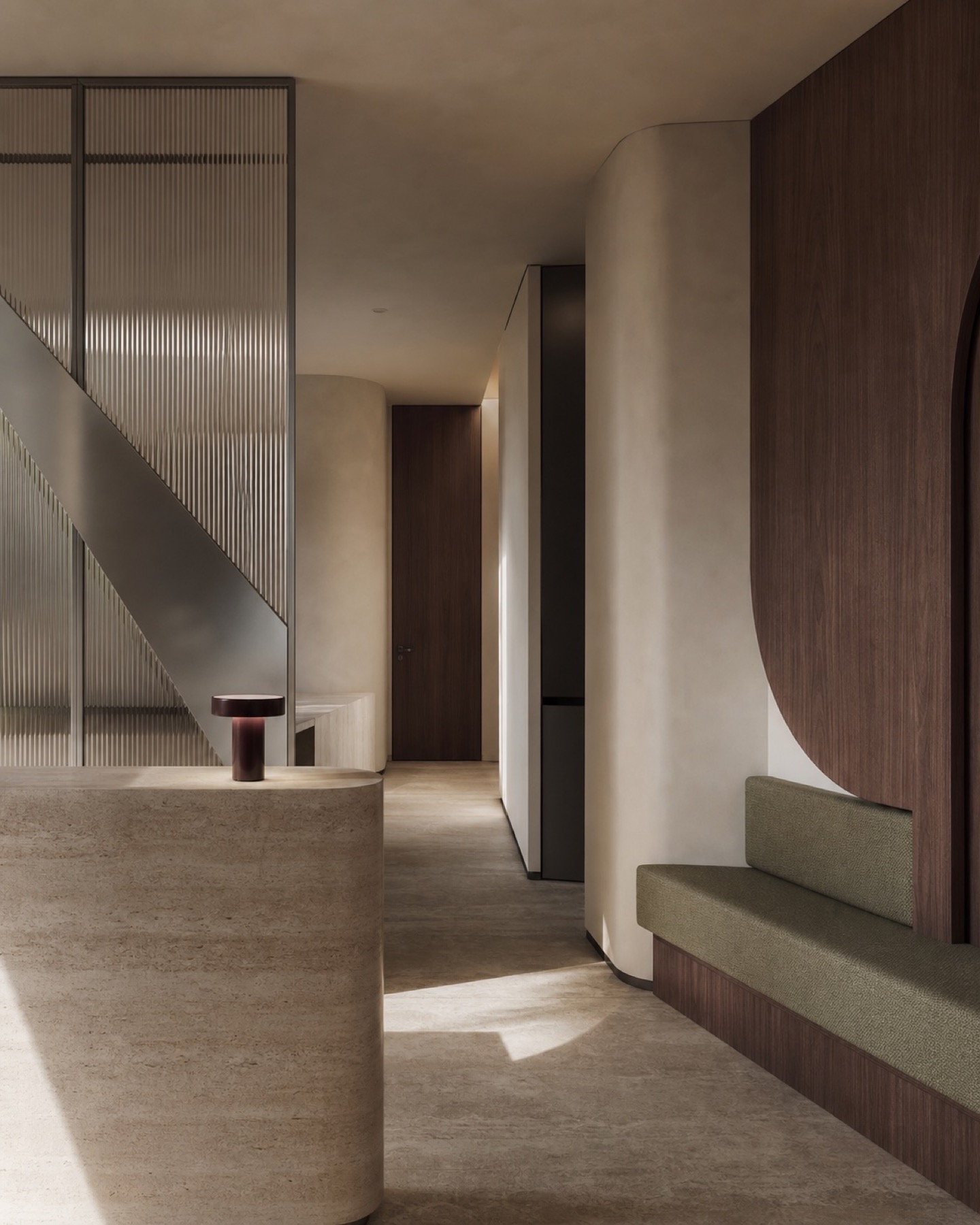 Quiet contemporary med spa interior with travertine, brushed metal, and warm wood